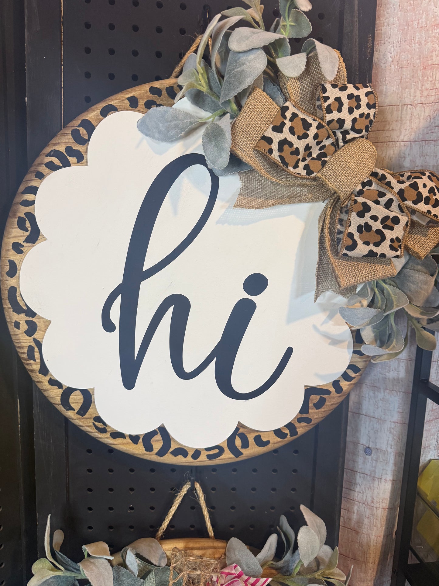 18” door hanger with scalloped wood on top. Hi, leopard print.