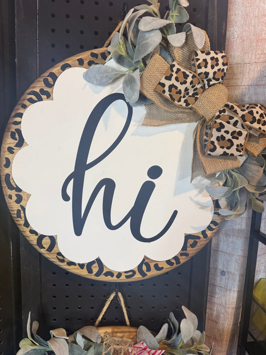 18” door hanger with scalloped wood on top. Hi, leopard print.